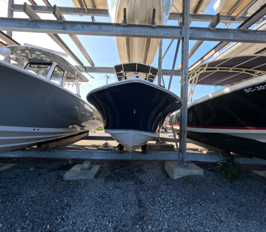 Boats on lifts at a marina, ready for mobile boat detailing