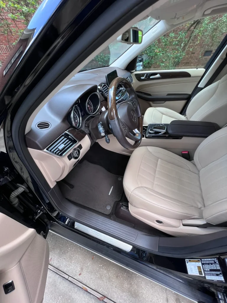 Tan leather SUV interior after detailing