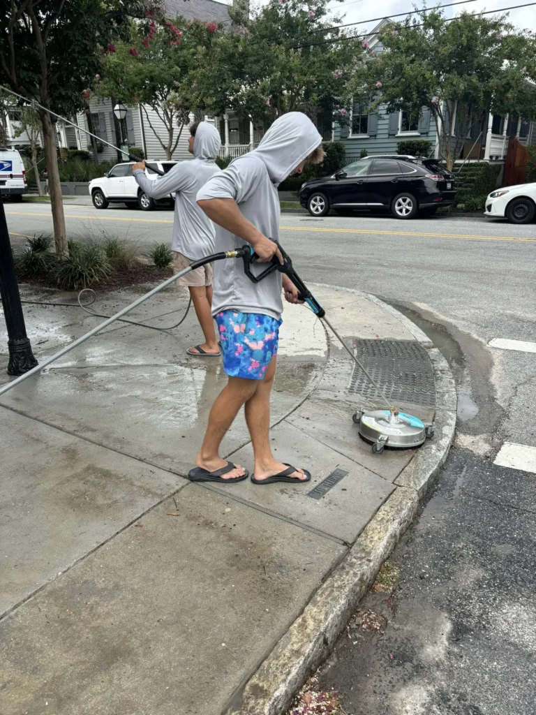 Pressure washing a sidewalk