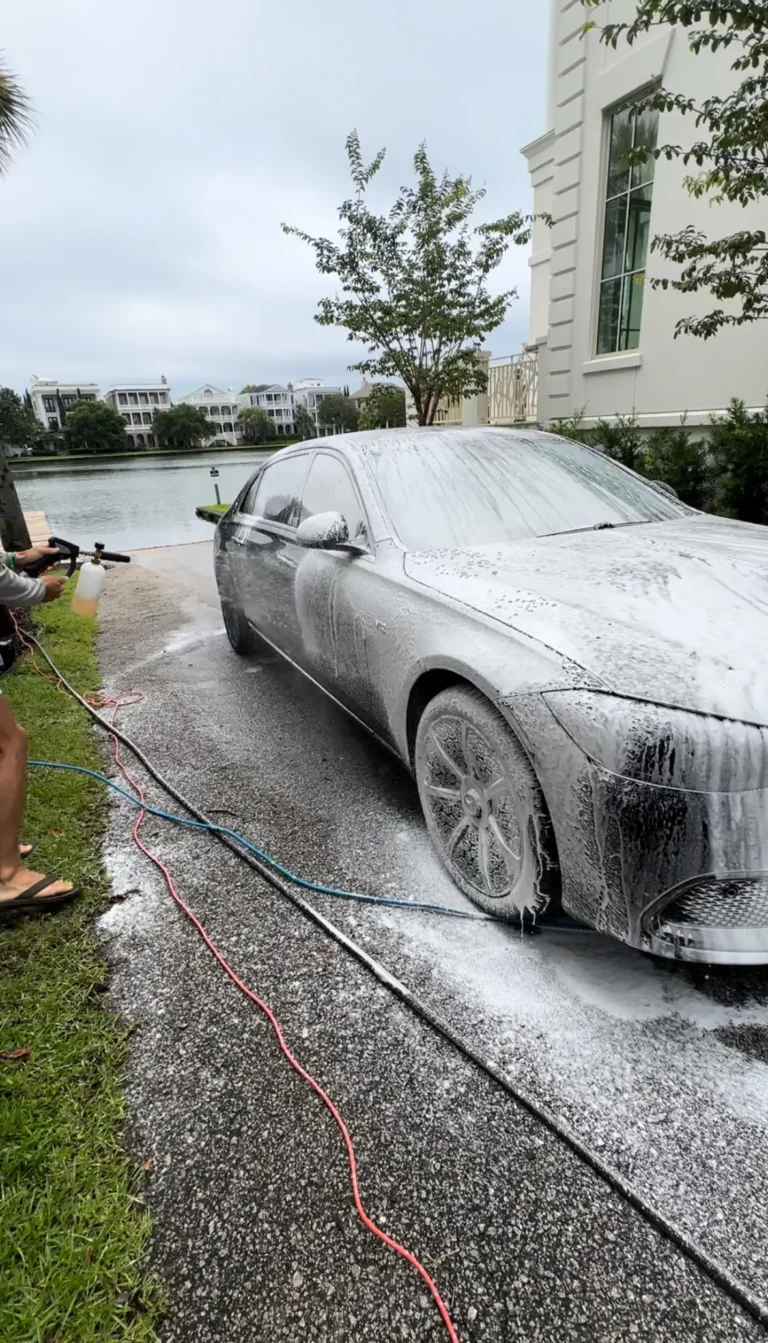 Foam wash on a sedan by the water